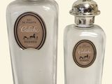two glass jars with silver lids on a white background