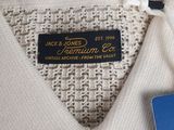 a picture of a white shirt with a tag on it