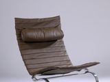 an image of a brown leather lounge chair on a white background