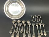 a lot of spoons and a bowl on the table