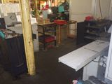 an image of a workshop with a lot of work equipment