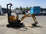 a small excavator that is parked in a parking lot