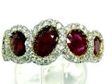 an image of a close up of a ring with red and white stones