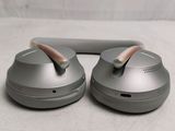 two ear buds sitting on top of each other on a table