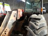 a tractor that is parked in a garage
