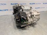 the engine of a car is shown in front of a wall