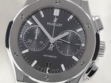 a close up of a watch with a black dial