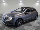 a picture of a silver mercedes b - class parked in a garage