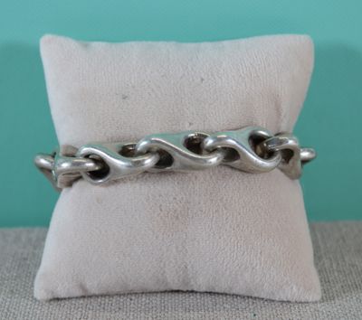 a close up of a ring on a pillow on a pillow