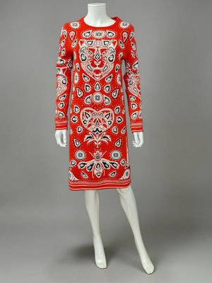 a red and white dress with a paisley pattern on it