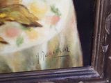 a picture of a painting of a cat on a table