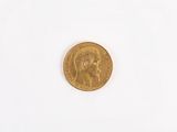 a gold coin with a picture of a woman on it