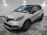 a white car is parked in a room with a checkered floor