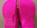a close up of a pair of pink children ' s shoes