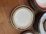 a lot of plates that are sitting on a table
