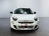 the front view of a white car parked in a showroom