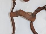 an image of a pair of leather harnesses and a pair of scissors