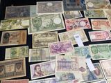 many different types of paper money on the table