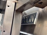 a close up of a metal door with a sign on it