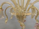 chandelier made of muranoni glass with pink and gold accents