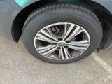 a close up of a car ' s tire on a parking lot