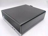 an image of a small black computer on a white surface