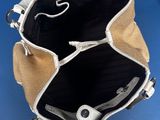 the inside of a purse with a zipper on the inside