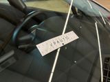 a sticker on the windshield of a car that says quality