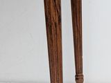 an image of a small wooden table with a drawer on it