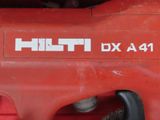 a close up of a red drill on a red table