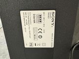 a close up of the back of a speaker with a button on it