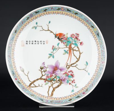 an image of a plate with a bird and flowers on it