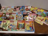 a lot of comics on the table in the room