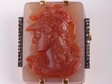 an image of a red and white carved cameo broochle