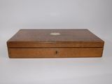 an old wooden box with a small apple logo on it