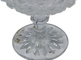 a clear glass bowl with a flower design on it