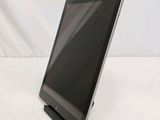 a tablet that is sitting on a stand on a table
