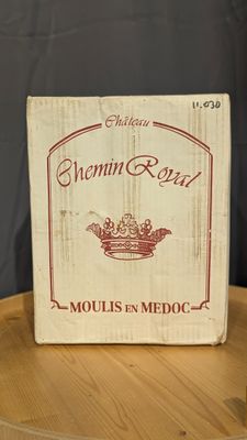 a box of wine sitting on top of a wooden table