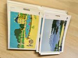 two folders with pictures of a beach scene on them