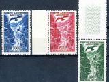 four different colored stamps on a black surface with a picture of a mountain