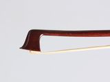 a close up of a violin bow with a wooden handle