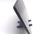 a close up of a cell phone that is on a stand