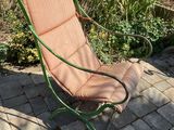 a chair that is sitting on a brick patio