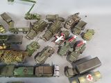 a lot of military toys that are on a white surface