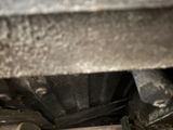 a close up view of a car ' s exhaust pipe and exhaust muffler