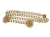 a close up of a gold chain bracelet with sun charms