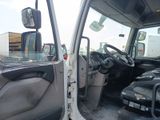 a white truck with the door open and the driver ' s seat down