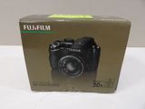 the box of a digital camera is sitting on the table