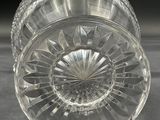 a glass vase that is sitting on a table