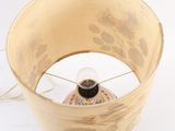 a lamp that is sitting on a white surface